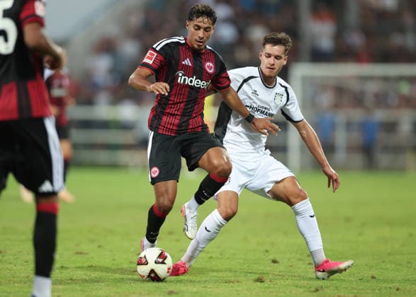 12.08.2026, Fussball Testspiel, FSV Frankfurt - Eintracht Frankfurt, v.l., Fares Chaibi (Eintracht Frankfurt), Leandro Simunic (FSV Frankfurt) DFL DFB REGULATIONS PROHIBIT ANY USE OF PHOTOGRAPHS AS IMAGE SEQUENCES AND OR QUASI-VIDEO. xdcx *** August 12, 2026, Soccer friendly match, FSV Frankfurt vs. Eintracht Frankfurt, from left: Fares Chaibi (Eintracht Frankfurt), Leandro Simunic (FSV Frankfurt). DFL and DFB regulations prohibit any use of photographs as image sequences and or quasi-video. xdcx Copyright: HMBxMedia Claus