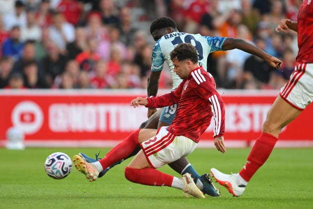 Nottingham Forest v Bayer 04 Leverkusen - Pre-Season Friendly Neco Williams of Nottingham Forest tackles Ernest Poku of Bayer Leverkusen during a pre-season friendly match between Nottingham Forest and Bayer Leverkusen at the City Ground in Nottingham, United Kingdom. Nottingham Nottinghamshire United Kingdom  Copyright: xMIxNewsx originalFilename:fletcher-nottingh260812_npVto.jpg