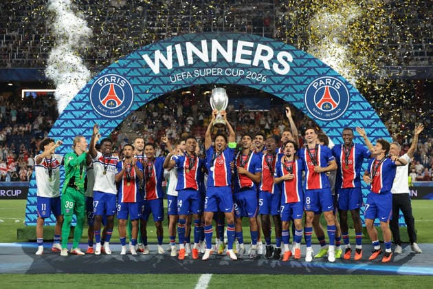 Paris Saint Germain v Aston Villa - UEFA Super Cup - Stadio Salzburg Salzburg, Austria, 12th August 2026. Paris Saint-Germain players; Marquinhos, Achraf Hakimi, Lucas Beraldo, Illia Zabarnyi, Khvicha Kvaratskhelia, Fabian Ruiz, Ousmane Dembele, Maghnes Akliouche, Lucas Digne, Desire Doue, Vitinha, Lucas Hernandez, Senny Mayulu, Nuno Mendes, Dro Fernandez, Bradley Barcola, Warren Zaire-Emery, Quentin Ndjantou Mbitcha, Ibrahim Mbaye, Willian Pacho and Joao Neves and Head Coach Luis Enrique celebrate with the trophy following the 2-1 victory in the Paris Saint Germain vs Aston Villa UEFA Super Cup match at Stadion Salzburg, Salzburg. Picture credit should read: Jonathan Moscrop Salzburg Stadion Salzburg Austria