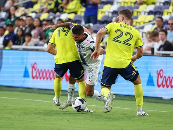 August 12, 2026: CF Monterrey midfielder Jesus Corona (17) is tripped up by Nashville SC midfielder Alex Muyl (19) and Nashville SC defender Josh Bauer (22) during a Leagues Cup match between CF Monterrey and Nashville SC at Geodis Park in Nashville, TN. CSM Nashville United States of America - ZUMAc04_ 20260812_zma_c04_048 Copyright: xStephenxFurstx