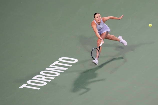 August 12, 2026, Toronto, On, CAN: Ukraine s Elina Svitolina chases a return from Poland s Iga Swiatek during National Bank Open tennis action in Toronto on Wednesday, August 12, 2026. Canada News - August 12, 2026  - ZUMAc35_ 20260812_zaf_c35_065 Copyright: xChrisxYoungx