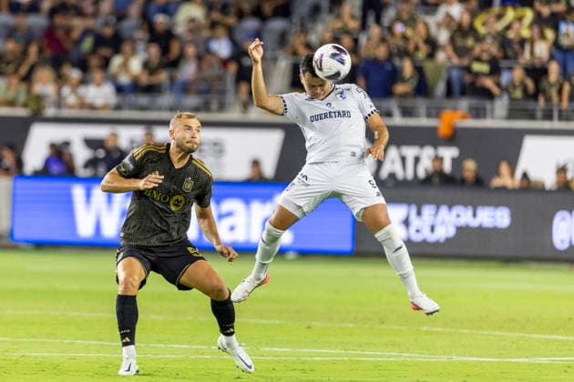 August 12, 2026, Los Angeles, California, USA: Club Quero taro forward AloÂ­ oÂvila (9) heads the away from Los Angeles FC defender Ryan Thomas Porteous (5) during a Leagues Club soccer match on Wednesday, Aug. 12, 2026 in Los Angeles. Los Angeles USA - ZUMAc68_ 20260812_zaf_c68_007 Copyright: xRingoxChiux