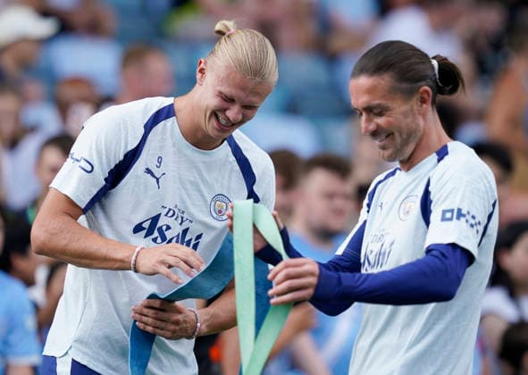 Manchester, England, Erling Haaland of Manchester City and Jack Grealish of Manchester City during a training session at the Joie Stadium, Manchester. Picture date: 13th August 2026. Picture credit should read: Andrew Yates Sportimage EDITORIAL USE ONLY. No use with unauthorised audio, video, data, fixture lists, club league logos or live services. Online in-match use limited to 120 images, no video emulation. No use in betting, games or single club league player publications. SPI_010_Man_City_Training SPI-4902-0015