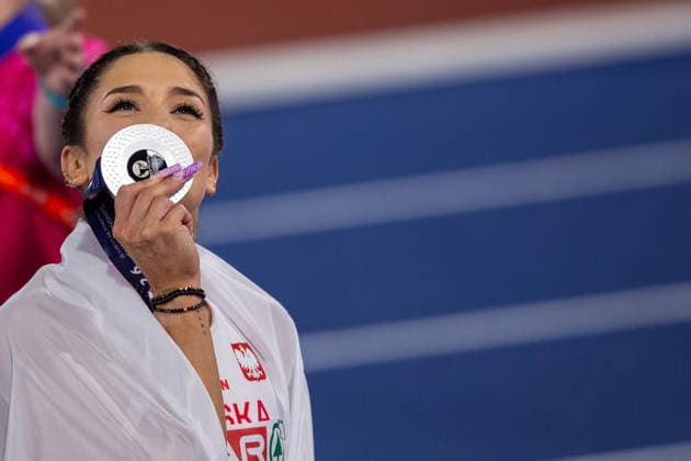 Ewa Swoboda of Poland kisses her silver medal after the Womens 100m at the European Athletics Championships at Alexander Stadium in Birmingham, England  Copyright: xSeanxWalshx Sportspressphoto_SPR205548