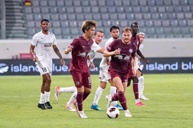 SOCCER - UEFA EL, Pafos vs RBS LIMASSOL,CYPRUS,13.AUG.26 - SOCCER - UEFA Europa League, qualification, Pafos FC vs Red Bull Salzburg. Image shows Sota Kitano and Yorbe Vertessen (RBS).  GEPAxpictures xXenophonxKarakalos