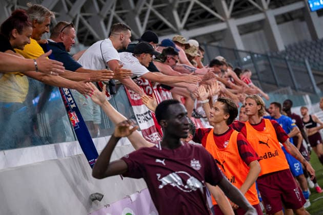 SOCCER - UEFA EL, Pafos vs RBS LIMASSOL,CYPRUS,13.AUG.26 - SOCCER - UEFA Europa League, qualification, Pafos FC vs Red Bull Salzburg. Image shows the team of RBS with fans.  GEPAxpictures xXenophonxKarakalo