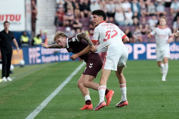 UK: Heart of Midlothian v Benfica, Europa League Qualifying Round 3 at Tynecastle Park , Edinburgh, Scotland on 13 August 2026: Pictured: Calvin Miller (Hearts) and Jose Neto (Benfica) Edinburgh Tynecastle Park Scotland Copyright: xAlexxToddx