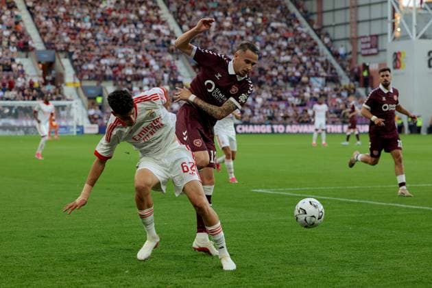 UK: Heart of Midlothian v Benfica - UEFA Europa League - 3rd Qualifying Round at Tynecastle Park in Edinburgh, Scotland on 13 August 2026 Heart of Midlothian v Benfica - UEFA Europa League - 3rd Qualifying Round at Tynecastle Park in Edinburgh, Scotland on 13 August 2026 Tom Renaud of Heart of Midlothian FC battles passed JosÃ Neto of SL Benfica Edinburgh Tynecastle Park Scotland Copyright: xJamesxChristiex
