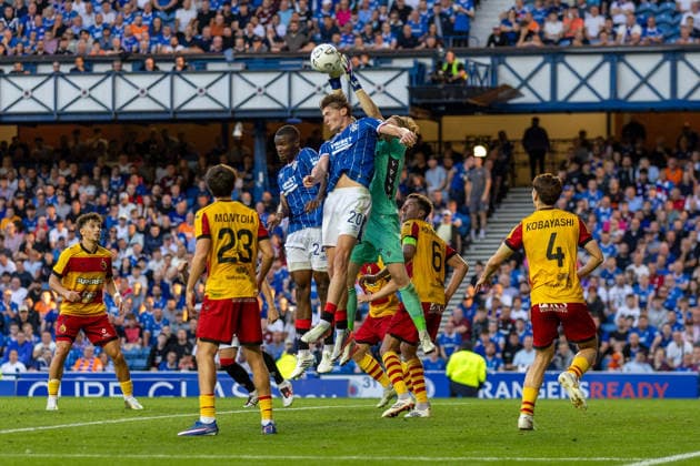 RECORD DATE NOT STATED 12th August 2026; Ibrox Stadium, Glasgow, Scotland; UEFA Europa League Qualifier Football, Rangers versus Jagiellonia Bialystok; Slawomir Abramowicz of Jagiellonia Bialystok jumps for the ball with Ryan Naderi of Rangers VagelisxGeorgariou