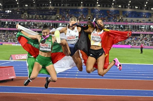 Bulgarian Aleksandra NACHEVA, winner of the bronze medal, Italian Dariya DERKACH, winner of the gold medal, Belgian Saliyya GUISSE, winner of the silver medal, pictured with their flags after the final of the women s triple jump event on the fourth day of the European Athletics Championships (August 10-18) in Birmingham, United Kingdom, on Thursday 13 August 2026. ERICxLALMAND  x183322687x