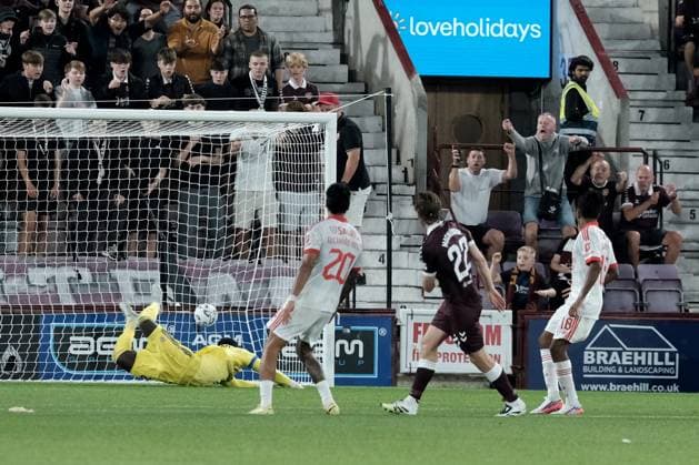 UK: Heart of Midlothian v Benfica, Europa League Qualifying Round 3 at Tynecastle Park , Edinburgh, Scotland on 13 August 2026: Pictured: Tomas Magnusson (Hearts) fires a shot past Benfica goalkeeper Samuel Soares to make it 1-0 Edinburgh Tynecastle Park Scotland Copyright: xAlexxToddx