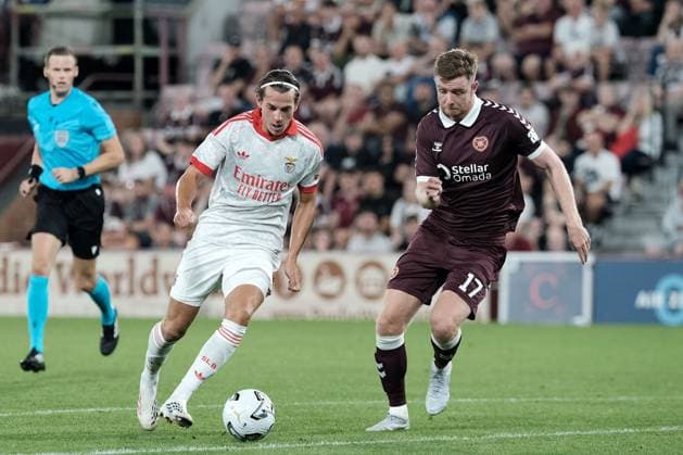 UK: Heart of Midlothian v Benfica, Europa League Qualifying Round 3 at Tynecastle Park , Edinburgh, Scotland on 13 August 2026: Pictured: Jakub Kaminski (Benfica) and Stuart Findlay (Hearts) Edinburgh Tynecastle Park Scotland Copyright: xAlexxToddx