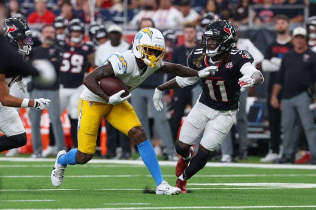 HOUSTON, TX - AUGUST 13: Wide receiver KeAndre Lambert-Smith of the Los Angeles Chargers runs with the ball after a reception as cornerback Tremon Smith of the Houston Texans pursues during the NFL, American Football Herren, USA preseason game between Houston Texans and Los Angeles Chargers on August 13, 2026, at Reliant Stadium in Houston, TX. (Photo by David Buono Icon Sportswire) NFL: AUG 13 Chargers at Texans EDITORIAL USE ONLY Icon260813005