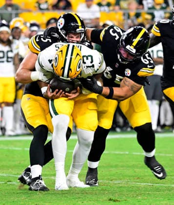 Pittsburgh Steelers linebacker Julius Welschof (45) and Pittsburgh Steelers defensive tackle Kyler Baugh (65) teams up to sack Green Bay Packers quarterback Kyron Drones (13) in the fourth quarter of the Steelers preseason win at Acrisure Stadium on Thursday, August 13, 2026 in Pittsburgh.  PIT2026081320 ARCHIExCARPENTER