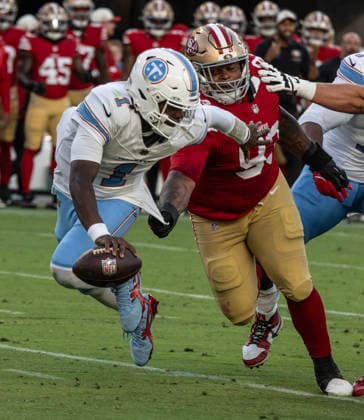 Tennessee Titans quarterback Cam Ward (1) tries to elude San Francisco 49ers defensive lineman Gracen Halton (93) in the second quarter at Levi s Stadium in Santa Clara, California on Thursday, August 13,, 2026. The Titans defeated the 49ers 19-13.  SXP2026081314 TERRYxSCHMITT