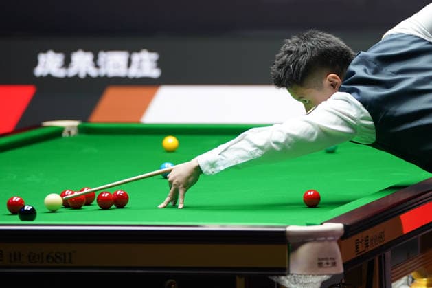 TAIYUAN, CHINA - AUGUST 14: Zhou Yuelong of China plays a shot in the Quarterfinal match against David Gilbert of England on day 7 of the 2026 World Snooker Tour China Open at Taiyuan Binhe Sports Center on August 14, 2026 in Taiyuan, Shanxi Province of China.  Copyright: xTaixChengzhex 111659923296
