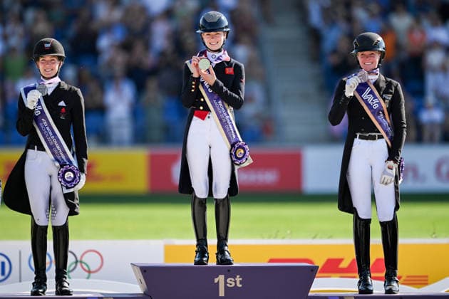 260814 Cathrine Laudrup-Dufour of Denmark celebrates second place, Charlotte Fry of Great Britain first place and Katharina Hemmer of Germany celebrates third place on the podium after competing in the Dressage Grand Prix Special during day 4 of the 2026 FEI World Championships on August 14, 2026 in Aachen. Photo: Emma Wallskog BILDBYRAN kod EW EW0682 ridsport equestrian rid-vm 2026 2026 fei world championships bbeng ridsport-vm dressage dressyr jubel *** August 14, 2026: Cathrine Laudrup Dufour of Denmark celebrates second place, Charlotte Fry of Great Britain celebrates first place, and Katharina Hemmer of Germany celebrates third place on the podium after competing in the Dressage Grand Prix Special on Day 4 of the 2026 FEI World Championships on August 14, 2026 in Aachen. Photo by Emma Wallskog. BILDBYRAN code EW EW0682 equestrian sports 2026 World Championships 2026 FEI World Championships BBENG equestrian sports World Championships dressage celebration  Copyright: EMMAxWALLSKOG BB260814EW099