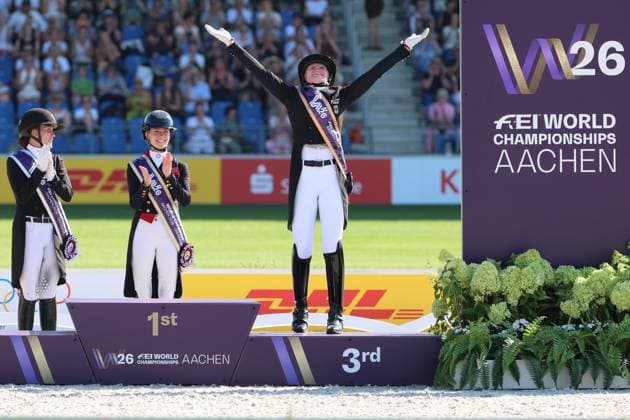 Jubel, Emotion, Siegerjubel, Emotion, 3. Platz und Bronze an Katharina Hemmer (GER, Deutschland, Germany) mit Pferd Denoix PCH, Weitere Platzierung, Siegerehrung: 1. Platz Charlotte Fry (GBR, Grossbritanien, Great Britain, Vereinigtes Königreich) Pferd Glamourdale, 2. Platz Cathrine Laudrup-Dufour (DEN, Dänemark, Denmark) Pferd Mount St John Freestyle, 3. Platz, Bronze, Katharina Hemmer (GER, Deutschland, Germany), Denoix PCH, Dressur, FEI Dressage World Championship, WM, Weltmeisterschaft MEGGLE-Preis, Grand Prix Special, Einzelwertung , AACHEN - FEI World Championships 2026, Weltfest des Pferdesports, Reitsport Weltmeisterschaft 2026, Aachen 2026, Welcome Home 2026, Aachener Soers, 11. bis 23. August 2026, Reitsport, 14.08.2026, Aachen Aachener Soers Deutschland *** Cheers, excitement, victory celebrations, excitement, 3rd place and bronze for Katharina Hemmer GER, Germany, with horse Denoix PCH; other placings; award ceremony: 1st place Charlotte Fry GBR, Great Britain, United Kingdom, with horse Glamourdale, 2nd place: Cathrine Laudrup Dufour (DEN), Denmark, on Mount St John Freestyle; 3rd place, bronze: Katharina Hemmer (GER), Germany, Denoix PCH, Dressage, FEI Dressage World Championship MEGGLE Prize, Grand Prix Special, Individual Competition, AACHEN FEI World Championships 2026, World Festival of Equestrian Sports, 2026 Equestrian World Championships, Aachen 2026, Welcome Home 2026, Aachen Soers, August 11–23, 2026, Equestrian Sports, August 14, 2026, Aachen Soers, Germany