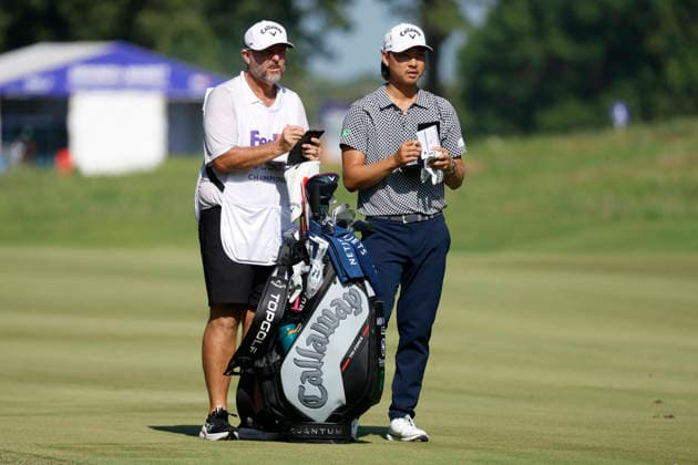 MEMPHIS, TN - AUGUST 14: Min Woo Lee of Australia and his caddie check the yardage in the No. 7 fairway during the second round of the FedEx St. Jude Championship, August 14, 2026, at TPC Southwind in Memphis, Tennessee. (Photo by Matthew Maxey Icon Sportswire) GOLF: AUG 14 PGA, Golf Herren FedEx St. Jude Championship EDITORIAL USE ONLY Icon260814025