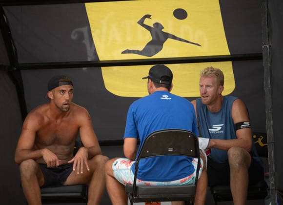 August 14, 2026, Manhattan Beach, California, USA: TREVOR CRABB (left) and partner CHASE BUDINGER (right) are coached during the opening match of the first round of the Manhattan Beach Open. Manhattan Beach USA - ZUMAl183 20260814_znp_l183_003 Copyright: xJasenxLaksx