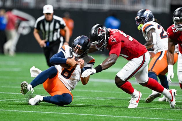ATLANTA, GA - AUGUST 14: Denver quarterback Jarrett Stidham (8) slides to the turf as Atlanta linebacker Azeez Ojulari (51) defends during the NFL, American Football Herren, USA pre-season game between the Denver Broncos and the Atlanta Falcons on August 14th, 2026 at Mercedes-Benz Stadium in Atlanta, GA. (Photo by Rich von Biberstein Icon Sportswire) NFL: AUG 14 Broncos at Falcons EDITORIAL USE ONLY Icon260814020