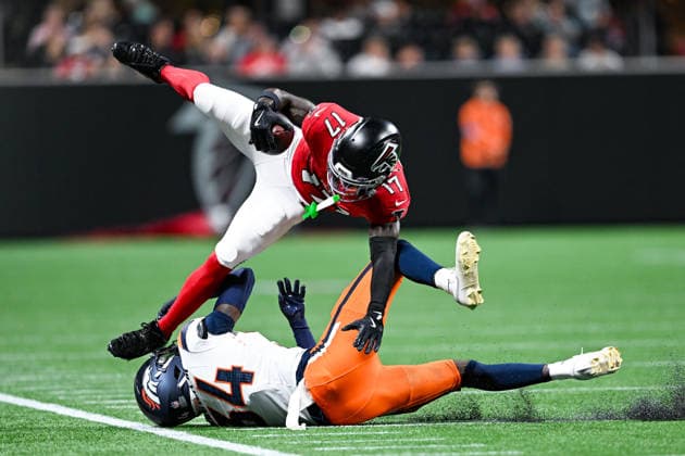 ATLANTA, GA - AUGUST 14: Atlanta wide receiver Zachariah Branch (17) goes airborne after being hit by Denver safety Jl Skinner (34) during the NFL, American Football Herren, USA pre-season game between the Denver Broncos and the Atlanta Falcons on August 14th, 2026 at Mercedes-Benz Stadium in Atlanta, GA. (Photo by Rich von Biberstein Icon Sportswire) NFL: AUG 14 Broncos at Falcons EDITORIAL USE ONLY Icon260814026
