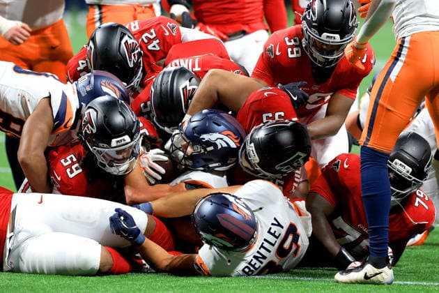 ATLANTA, GA - AUGUST 14: The Falcons pile up on Cody Schrader (25) of the Denver Broncos during the Friday evening NFL, American Football Herren, USA preseason football game between the Atlanta Falcons and the Denver Broncos on August 14, 2026 at Mercedes-Benz Stadium in Atlanta, Georgia. (Photo by David J. Griffin Icon Sportswire) NFL: AUG 14 Broncos at Falcons EDITORIAL USE ONLY Icon9532608145258
