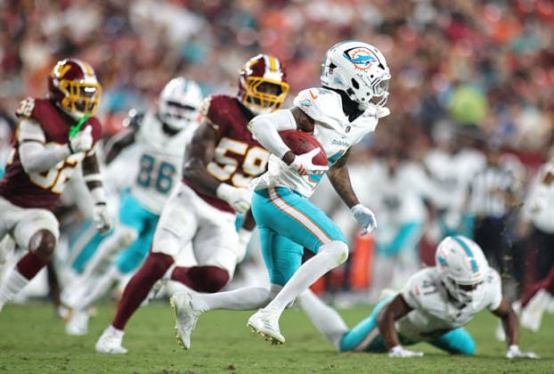August 14, 2026, Landover, Maryland, USA: Miami Dolphins wide receiver Tutu Atwell (4) carries the ball during the NFL, American Football Herren, USA preseason game between the Washington Commanders and Miami Dolphins at Northwest Stadium on Friday, August 14, 2026; Landover, Maryland, USA. Landover USA - ZUMAs325 20260814_zsp_s325_188 Copyright: xJessxStilesx