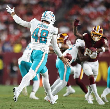 August 14, 2026, Landover, Maryland, USA: Miami Dolphins punter Bradley Pinion (48) kicks the ball during the NFL, American Football Herren, USA preseason game between the Washington Commanders and Miami Dolphins at Northwest Stadium on Friday, August 14, 2026; Landover, Maryland, USA. Landover USA - ZUMAs325 20260814_zsp_s325_192 Copyright: xJessxStilesx