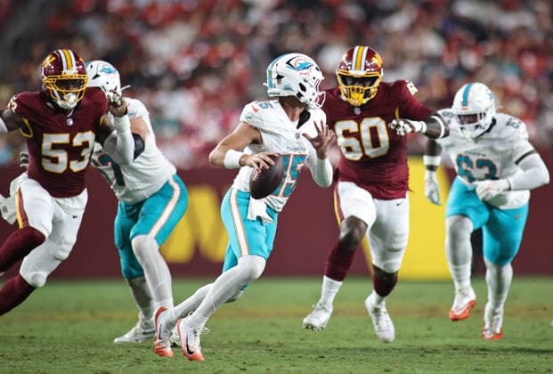 August 14, 2026, Landover, Maryland, USA: Miami Dolphins quarterback Cam Miller (15) looks to pass the ball during the NFL, American Football Herren, USA preseason game between the Washington Commanders and Miami Dolphins at Northwest Stadium on Friday, August 14, 2026; Landover, Maryland, USA. Landover USA - ZUMAs325 20260814_zsp_s325_193 Copyright: xJessxStilesx