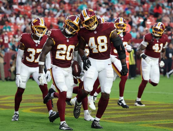 August 14, 2026, Landover, Maryland, USA: Washington Commanders safety QUAN MARTIN (20) and Washington Commanders linebacker JOSHUA JOSEPHS (48) celebrate a play during the NFL, American Football Herren, USA preseason game between the Washington Commanders and Miami Dolphins at Northwest Stadium. Commanders won 20-7. Landover USA - ZUMAs325 20260814_zsp_s325_011 Copyright: xJessxStilesx