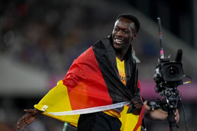 ATHLETICS - European Athletics Championships BIRMINGHAM,ENGLAND,14.AUG.26 - ATHLETICS - European Athletics Championships, 200m,Men. Image shows the rejoicing ofOwen Ansah (GER). Keywords: flag.  GEPAxpictures xRanjithxKumar