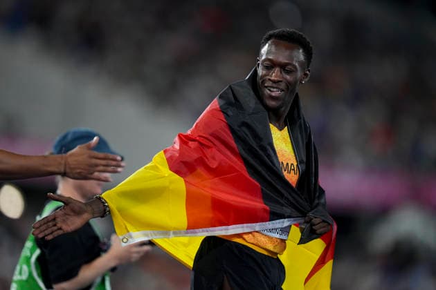 ATHLETICS - European Athletics Championships BIRMINGHAM,ENGLAND,14.AUG.26 - ATHLETICS - European Athletics Championships, 200m,Men. Image shows the rejoicing ofOwen Ansah (GER). Keywords: flag.  GEPAxpictures xRanjithxKumar