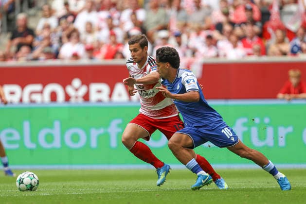 Tim Oberdorf (Fortuna Duesseldorf) und Yasin Batuhan Muhammed Zor (TSG Hoffenheim II) im Zweikampf waehrend des Spiels der 3. Liga zwischen Fortuna Duesseldorf und TSG 1899 Hoffenheim II, Merkur Spiel-Arena am 15. August 2026 in Duesseldorf, Deutschland. (Foto von Oliver Kaelke DeFodi Images) +++ Tim Oberdorf (Fortuna Duesseldorf) und Yasin Batuhan Muhammed Zor (TSG Hoffenheim II) battle for the ball during the 3. Liga match between Fortuna Duesseldorf and TSG 1899 Hoffenheim II at Merkur Spiel-Arena on August 15, 2026 in Dusseldorf, Germany. (Photo by Oliver Kaelke DeFodi Images) DFB DFL REGULATIONS PROHIBIT ANY USE OF PHOTOGRAPHS AS IMAGE SEQUENCES AND OR QUASI-VIDEO. (Photo by Oliver Kaelke DeFodi Images) - *** Tim Oberdorf of Fortuna Düsseldorf and Yasin Batuhan Muhammed Zor of TSG Hoffenheim II in a tackle during the 3. Liga match between Fortuna Düsseldorf and TSG 1899 Hoffenheim II, Merkur Spiel Arena on August 15, 2026, in Düsseldorf, Germany. Photo by Oliver Kaelke, DeFodi Images. Tim Oberdorf of Fortuna Düsseldorf and Yasin Batuhan Muhammed Zor of TSG Hoffenheim II battle for the ball during the 3. Liga match between Fortuna Düsseldorf and TSG 1899 Hoffenheim II at Merkur Spiel Arena on August 15, 2026 in Düsseldorf, Germany. Photo by Oliver Kaelke, DeFodi Images. DFB and DFL regulations prohibit any use of photographs as image sequences and or quasi-video. Photo by Oliver Kaelke, DeFodi Images.