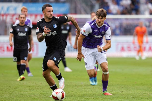 2026.08.15, xkwix, Fußball, 2. Bundesliga, VfL Osnabrück - 1. FC Magdeburg, Stadion an der Bremer Brücke, 2.Spieltag, Saison 2026 2027: Falko Michel (1. FC Magdeburg 21) im Zweikampf gegen Bernd Riesselmann (VfL Osnabrueck 22) DFB regulations prohibit any use of photographs as image sequences and or quasi-video. Photo: xKamilxWilkowskixPressefotoKochx Niedersachsen Deutschland *** August 15, 2026, xkwix, Soccer, 2. Bundesliga, VfL Osnabrück 1 FC Magdeburg, Stadion an der Bremer Brücke, Matchday 2, 2026–2027 Season: Falko Michel (1 FC Magdeburg) 21 in a tackle against Bernd Riesselmann (VfL Osnabrück) 22. DFB regulations prohibit any use of photographs as image sequences and or quasi-video. Photo: xKamilxWilkowskixPressefotoKochx, Lower, Germany