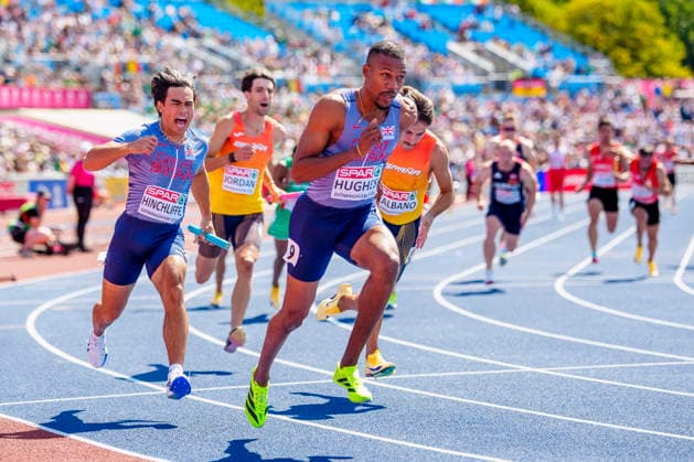 BIRMINGHAM, GREAT BRITAIN - AUGUST 15, 2026 : Louie HINCHLIFFE (GBR Great Britain) and Zharnel HUGHES (GBR Great Britain) competing in the 4x100m relay heats during the European Athletics Championships at Alexander Stadium on August 15, 2026 in Birmingham, Great Britain. Great Britain Copyright: xLeahxKohringx