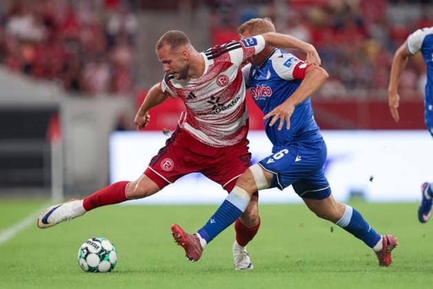Eric Hottmann (Fortuna Duesseldorf) und Valentin Laessig (TSG Hoffenheim II) im Zweikampf waehrend des Spiels der 3. Liga zwischen Fortuna Duesseldorf und TSG 1899 Hoffenheim II, Merkur Spiel-Arena am 15. August 2026 in Duesseldorf, Deutschland. (Foto von Oliver Kaelke DeFodi Images) +++ Eric Hottmann (Fortuna Duesseldorf) und Valentin Laessig (TSG Hoffenheim II) battle for the ball during the 3. Liga match between Fortuna Duesseldorf and TSG 1899 Hoffenheim II at Merkur Spiel-Arena on August 15, 2026 in Dusseldorf, Germany. (Photo by Oliver Kaelke DeFodi Images) DFB DFL REGULATIONS PROHIBIT ANY USE OF PHOTOGRAPHS AS IMAGE SEQUENCES AND OR QUASI-VIDEO. (Photo by Oliver Kaelke DeFodi Images) - *** Eric Hottmann of Fortuna Düsseldorf and Valentin Laessig of TSG Hoffenheim II battle for the ball during the 3. Liga match between Fortuna Düsseldorf and TSG 1899 Hoffenheim II at the Merkur Spiel Arena on August 15, 2026, in Düsseldorf, Germany. Photo by Oliver Kaelke, DeFodi Images. Eric Hottmann of Fortuna Düsseldorf and Valentin Laessig of TSG Hoffenheim II battle for the ball during the 3. Liga match between Fortuna Düsseldorf and TSG 1899 Hoffenheim II at Merkur Spiel Arena on August 15, 2026 in Düsseldorf, Germany. Photo by Oliver Kaelke, DeFodi Images. DFB and DFL regulations prohibit any use of photographs as image sequences and or quasi-video. Photo by Oliver Kaelke, DeFodi Images.