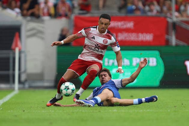 Steven van der Sloot (Fortuna Duesseldorf) und Maximilian Raphael Theuer (TSG Hoffenheim II) im Zweikampf waehrend des Spiels der 3. Liga zwischen Fortuna Duesseldorf und TSG 1899 Hoffenheim II, Merkur Spiel-Arena am 15. August 2026 in Duesseldorf, Deutschland. (Foto von Oliver Kaelke DeFodi Images) +++ Steven van der Sloot (Fortuna Duesseldorf) und Maximilian Raphael Theuer (TSG Hoffenheim II) battle for the ball during the 3. Liga match between Fortuna Duesseldorf and TSG 1899 Hoffenheim II at Merkur Spiel-Arena on August 15, 2026 in Dusseldorf, Germany. (Photo by Oliver Kaelke DeFodi Images) DFB DFL REGULATIONS PROHIBIT ANY USE OF PHOTOGRAPHS AS IMAGE SEQUENCES AND OR QUASI-VIDEO. (Photo by Oliver Kaelke DeFodi Images) - *** Steven van der Sloot of Fortuna Düsseldorf and Maximilian Raphael Theuer of TSG Hoffenheim II go head-to-head during the 3. Liga match between Fortuna Düsseldorf and TSG 1899 Hoffenheim II, Merkur Spiel Arena on August 15, 2026, in Düsseldorf, Germany. Photo by Oliver Kaelke, DeFodi Images. Steven van der Sloot of Fortuna Düsseldorf and Maximilian Raphael Theuer of TSG Hoffenheim II battle for the ball during the 3. Liga match between Fortuna Düsseldorf and TSG 1899 Hoffenheim II at Merkur Spiel Arena on August 15, 2026 in Düsseldorf, Germany. Photo by Oliver Kaelke, DeFodi Images. DFB and DFL regulations prohibit any use of photographs as image sequences and or quasi-video. Photo by Oliver Kaelke, DeFodi Images.