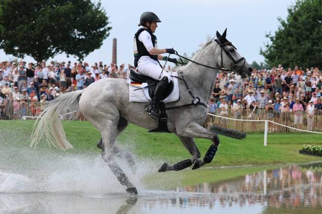 Malin Hansen-Hotopp (GER, Deutschland, Germany) mit Pferd Carlitos Quidditch K, Allianz Versicherung, Wasserhindernis , Vielseitigkeit Dressur, FEI Eventing World Championship, WM, Weltmeisterschaft , DHL-Preis, Einzel Mannschaft, Geländeprüfung, Teilprüfung Gelände, Cross Country , AACHEN - FEI World Championships 2026, Weltfest des Pferdesports, Reitsport Weltmeisterschaft 2026, Aachen 2026, Welcome Home 2026, Aachener Soers, 11. bis 23. August 2026, Reitsport, 15.08.2026, Aachen Aachener Soers Deutschland *** Malin Hansen Hotopp GER, Germany, with her horse Carlitos Quidditch K, Allianz Insurance, Water Jumping, Eventing Dressage, FEI Eventing World Championship, DHL Prize, Individual and Team, Cross-Country, Cross-Country Stage, AACHEN FEI World Championships 2026, World Festival of Equestrian Sports, 2026 Equestrian World Championships, Aachen 2026, Welcome Home 2026, Aachen Soers, August 11–23, 2026, Equestrian Sports, August 15, 2026, Aachen Soers, Germany