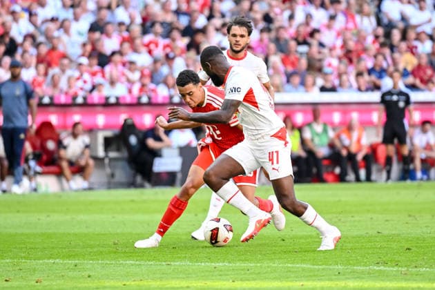 Jamal Musiala (FC Bayern Muenchen) and Lutsharel Geertruida (RB Leipzig) battle for the ball during the Telekom Cup match between FC Bayern Muenchen and RB Leipzig at Allianz Arena on August 15, 2026 in Munich, Germany. (Photo by Harry Langer DeFodi Images) - *** Jamal Musiala of FC Bayern Munich and Lutsharel Geertruida of RB Leipzig battle for the ball during the Telekom Cup match between FC Bayern Munich and RB Leipzig at Allianz Arena on August 15, 2026, in Munich, Germany. Photo by Harry Langer, DeFodi Images