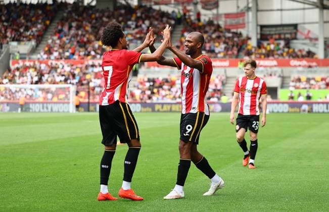 Kevin Schade of Brentford celebrates scoring their sides seventh goal with team-mate Igor Thiago of Brentford Brentford v Eintracht Frankfurt, Pre Season Friendly, Football, Gtech Community Stadium, London, UK - 15 Aug 2026London Gtech Community Stadium United Kingdom EDITORIAL USE ONLY No use with unauthorised audio, video, data, fixture lists, club league logos or live services. Online in-match use limited to 120 images, no video emulation. No use in betting, games or single club league player publications.  Copyright: xMichaelxZemanek Shutterstockx 17070130al