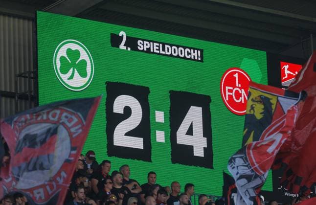 15.08.2026 - Fussball - Saison 2026 2027 - 2. Fussball - Bundesliga - 02. Spieltag: SpVgg Greuther Fürth ( Kleeblatt ) - 1. FC Nürnberg FCN ( Club ) Derby Frankenderby - Sportfoto Zink DaMa - xdaxmax - DFL regulations prohibit any use of photographs as image sequences and or quasi-video - only for editorial use - Symbolbild Symbolfoto Feature Impression - Anzeigentafel mit Endstand 2:4 für den FCN *** August 15, 2026 Soccer Season 2026–2027 Matchday 2 Bundesliga 02 SpVgg Greuther Fürth Kleeblatt vs. 1. FC Nürnberg FCN Club Derby Franconian Derby Sports photo Zink DaMa xdaxmax DFL regulations prohibit any use of photographs as image sequences and or quasi-video; for editorial use only. Symbolic image, feature photo, impression: Scoreboard showing the final score of 2–4 for FCN
