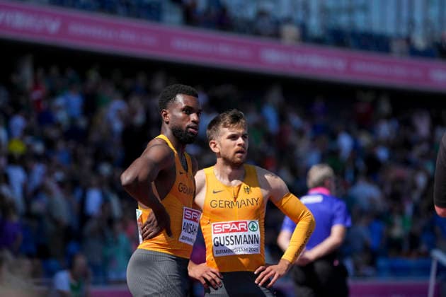 ATHLETICS - European Athletics Championships BIRMINGHAM,ENGLAND,15.AUG.26 - ATHLETICS - European Athletics Championships, 4x100m, relay, Men. Image shows Lucas Ansah-Peprah and Heiko Gussmann (GER).  GEPAxpictures xRanjithxKumar