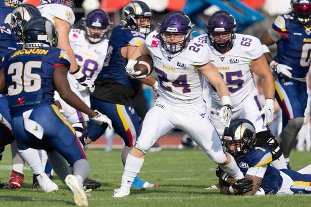 Karri Pajarinen (Vienna Vikings, 24) carries the football during a rushing play, driving forward past defenders on the field of play.Vienna Vikings at Alpine Rams, American Football, American Football League Europe, Week 13, 2026, 8.8.2026, Copyright: xPFA RicoxDoninellix