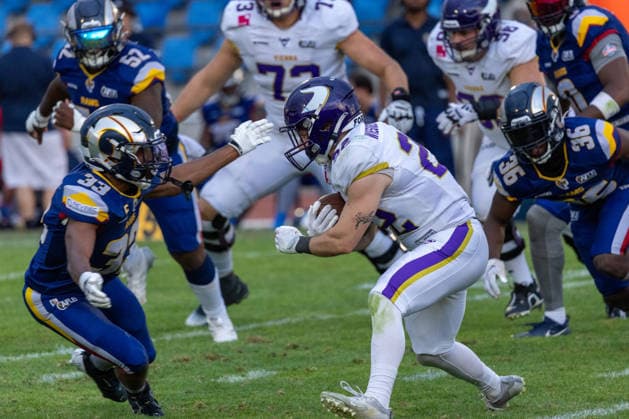 Albert Wiesigstrauch (Vienna Vikings, 22) carries the football while driving forward past Samuel Leppänen (Alpine Rams, 33) during a rushing play. Vienna Vikings at Alpine Rams, American Football, American Football League Europe, Week 13, 2026, 8.8.2026, Copyright: xPFA RicoxDoninellix
