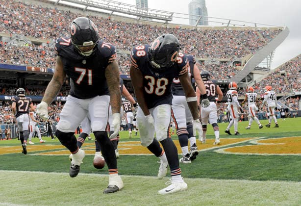 Chicago Bears running back Brittain Brown (38) celebrates his third quarter touchdown against the Cleveland Browns with Jedrick Wills Jr. (71) during a preseason game at Soldier Field in Chicago on Saturday, August 15, 2026. The Bears defeated the Brown 34-10.  CHI20260815118 MARKxBLACK