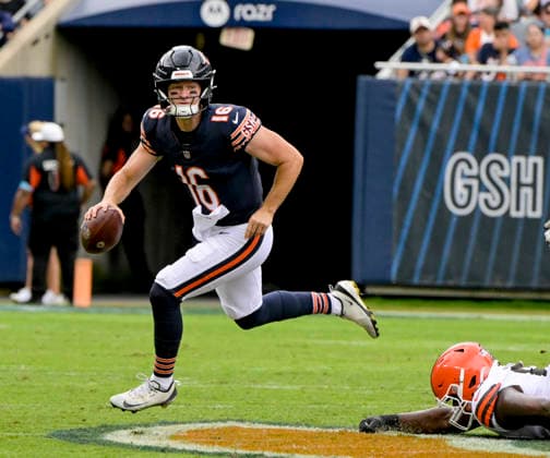 Chicago Bears quarterback Miller Moss (16) scrambles with the ball against the Cleveland Browns during the during a preseason game at Soldier Field in Chicago on Saturday, August 15, 2026. The Bears defeated the Brown 34-10.  CHI20260815127 MARKxBLACK