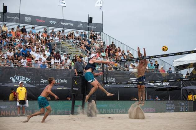 August 15, 2026, Manhattan Beach, California, USA: ANDY BENESH (center) spikes a ball as partner TAYLOR CRABB looks on during their first match on day two at the Manhattan Beach Open. Manhattan Beach USA - ZUMAl183 20260815_znp_l183_020 Copyright: xJasenxLaksx