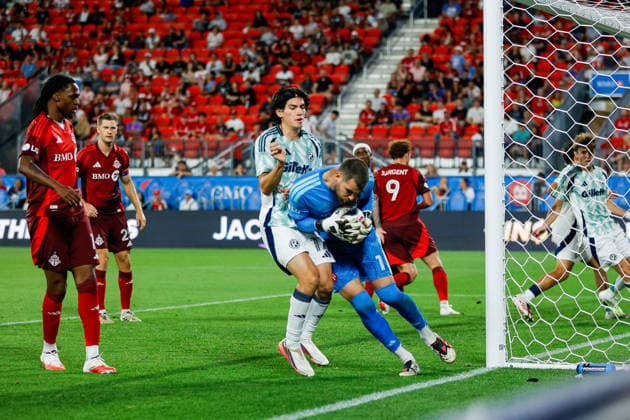 Toronto FC v New England Revolution Luka Gavran 1 of Toronto FC protects the ball from Marcos Zambrano 17 of New England Revolution during a Major League Soccer game between Toronto FC and New England Revolution at BMO Field in Toronto, Ontario, Canada, on August 15, 2026. Toronto Ontario Canada  Copyright: xIndrawanxKumalax originalFilename:kumala-majorlea260815_npM1v.jpg