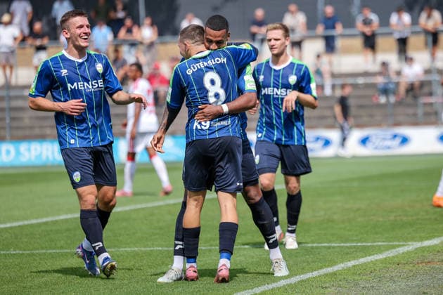 16.08.2026, xsefx, Fußball, 1.FC Köln II U21, U 21 - FC Gütersloh, Regionalliga West, Franz-Kremer-Stadion, 3. Spieltag, Saison 2026 2027: Torjubel nach dem Tor zum 2:0 durch Torschütze David Winke (FC Gütersloh 17) zusammen mit Phil Beckhoff (FC Gütersloh 08) DFB regulations prohibit any use of photographs as image sequences and or quasi-video. Nordrhein-Westfalen Deutschland *** August 16, 2026, xsefx, Soccer, 1. FC Köln II vs. U21 FC Gütersloh, Regionalliga West, Franz Kremer Stadium, Matchday 3, 2026–2027 Season. Celebrations after the 2–0 goal scored by David Winke (FC Gütersloh 17) alongside Phil Beckhoff (FC Gütersloh 08). DFB regulations prohibit any use of photographs as image sequences and or quasi-video. North Rhine-Westphalia, Germany